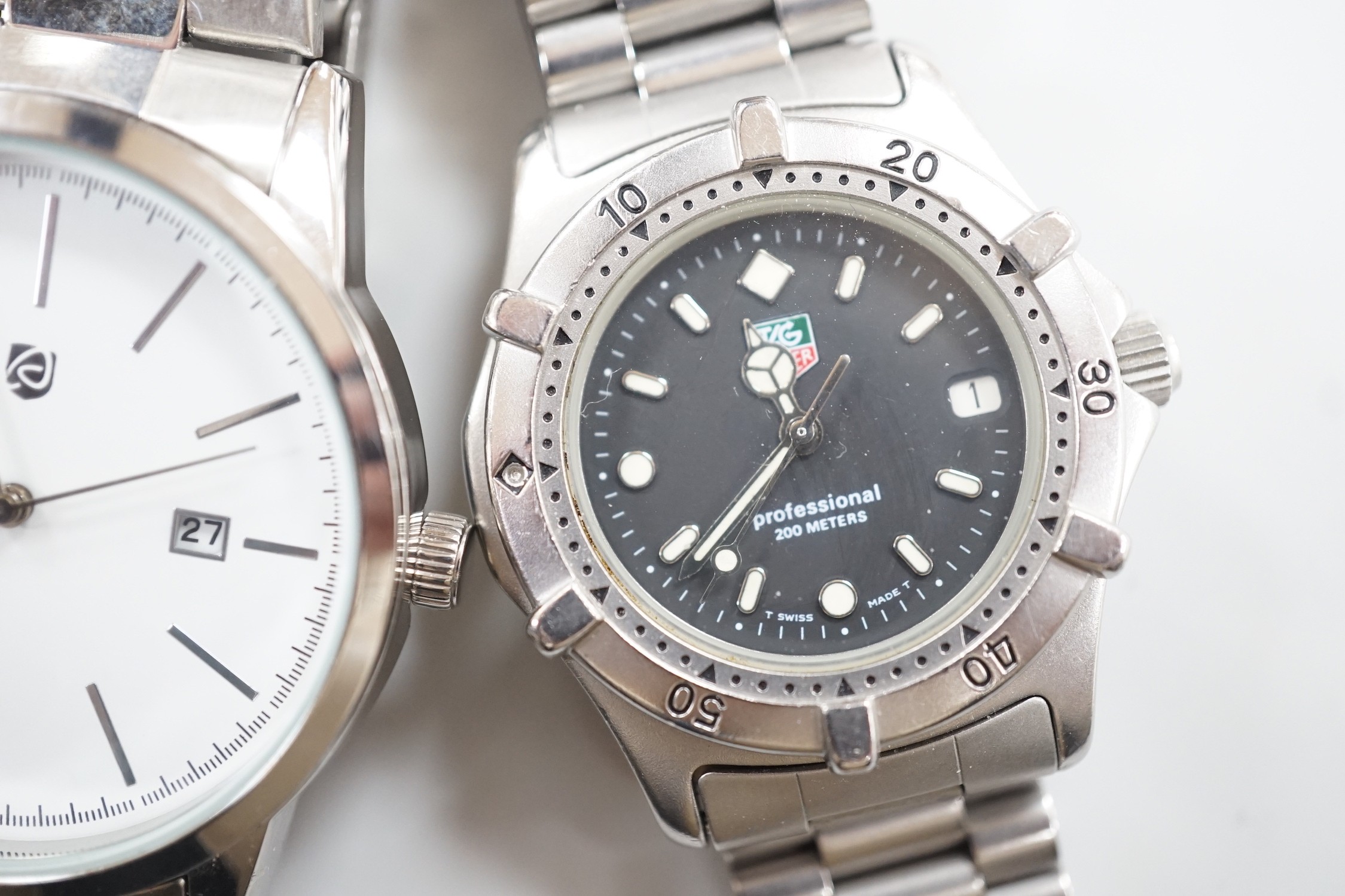 A gentleman's stainless steel Tag Heuer quartz wrist watch, together with a gentleman's stainless steel backed Owim GMBH & Co quartz wrist watch.